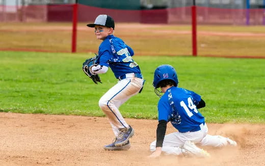 a couple of kids playing baseball