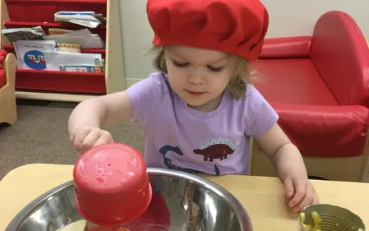 a child in a red hat