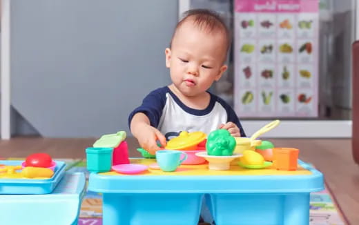 a baby playing with toys