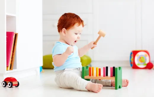 a baby playing with toys