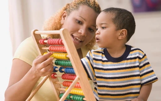 a person and a boy playing with toys