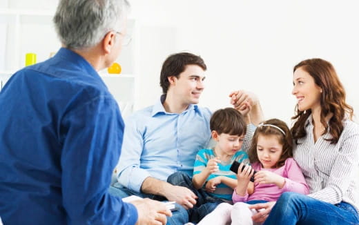 a family sitting on the floor