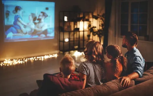 a group of people watching a television