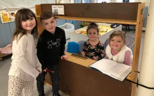 a group of children in a classroom