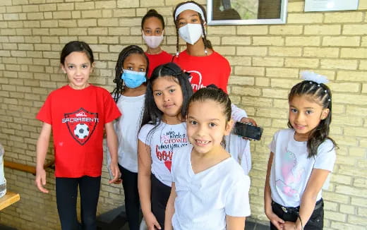 a group of children wearing face masks