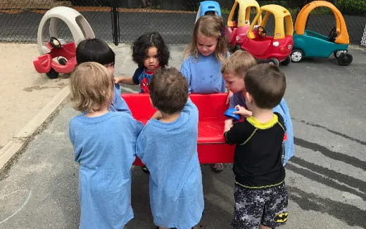 a group of children playing with toys