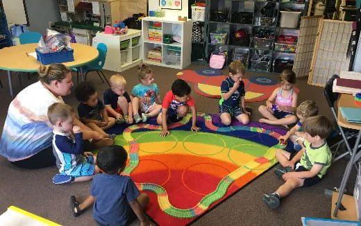 a group of children sitting on the floor