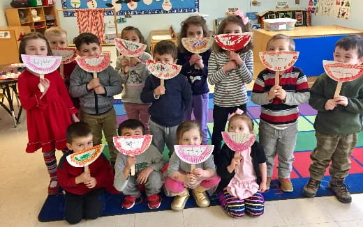 a group of children holding food