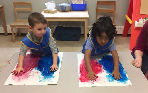 a couple of children sitting on the floor