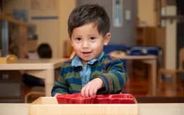 a boy sitting at a desk