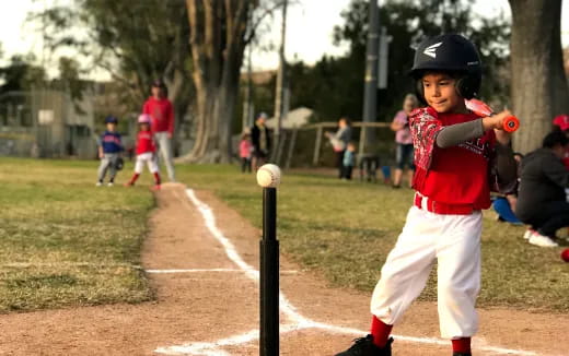 a young boy playing baseball