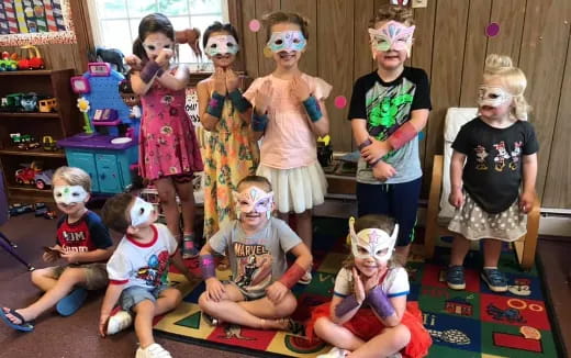 a group of children wearing masks