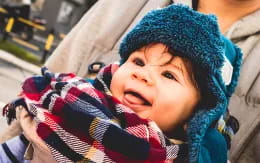 a baby in a knit hat