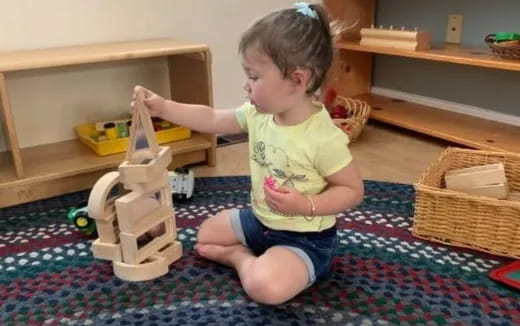 a baby playing with a toy