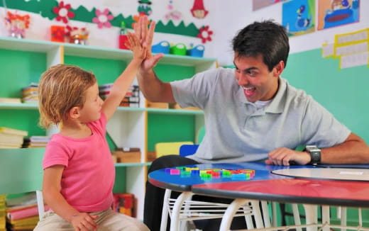 a person and a child in a classroom