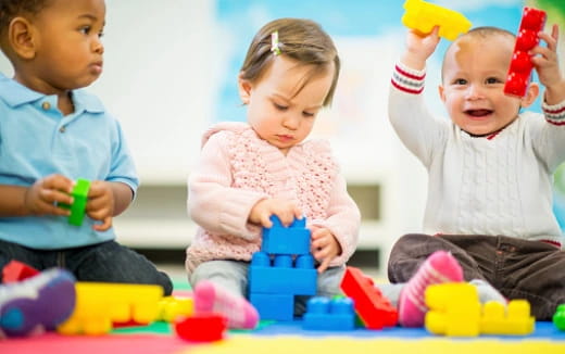 a group of children playing with toys