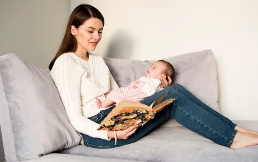 a woman holding a baby