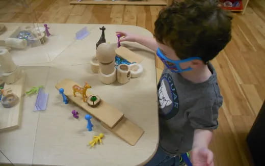 a child painting on a table