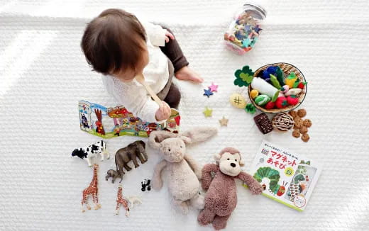 a baby playing with toys