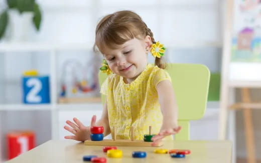 a girl playing with toys