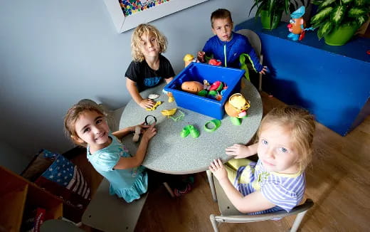 a group of kids playing with toys