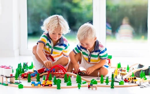 a couple of children playing with toys