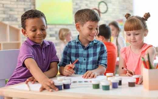 a group of children painting