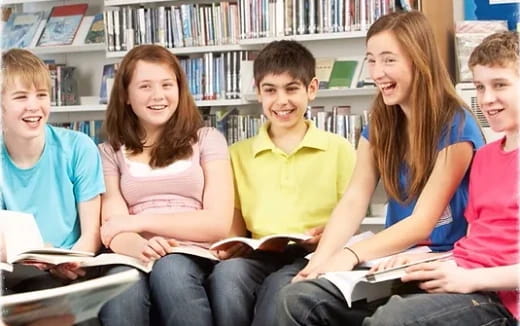 a group of students sitting in a library
