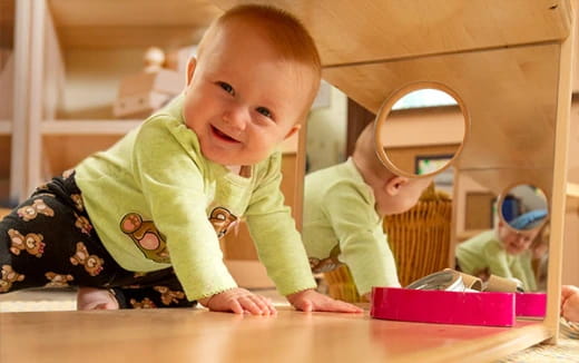 a baby crawling on a table