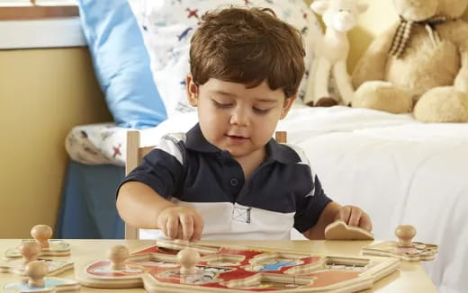 a boy sitting at a table