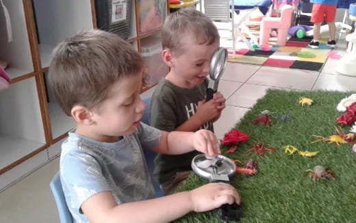 a couple of boys playing with a toy