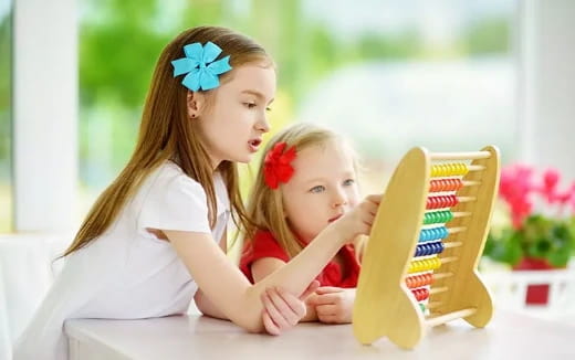 a person and a child looking at a box