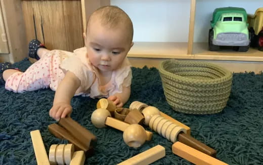 a baby playing with toys