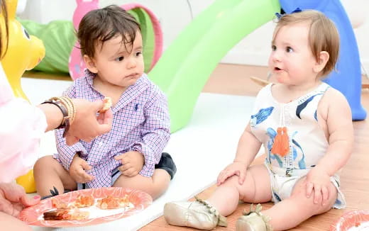 a couple of young girls eating