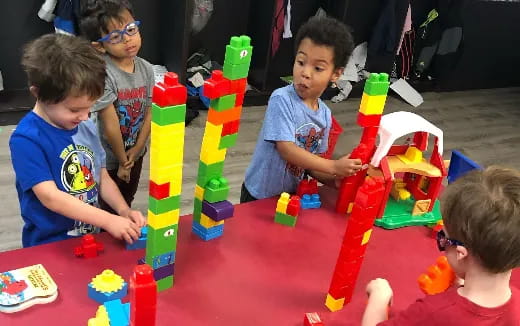 a group of children playing with toys