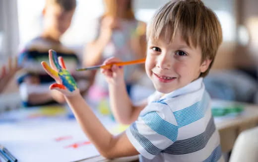 a young boy painting