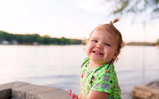 a child smiling for the camera