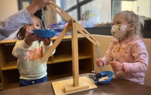 a couple of children painting