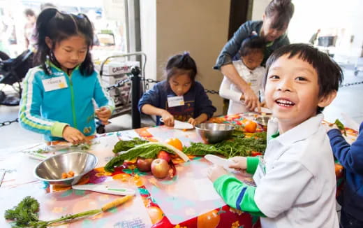 a group of children eating food