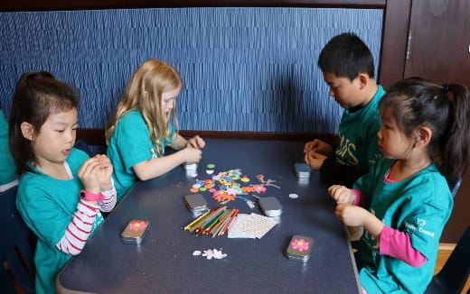 a group of children playing a board game