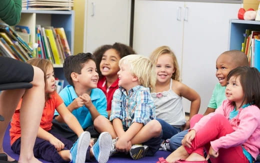 a group of children sitting on a couch