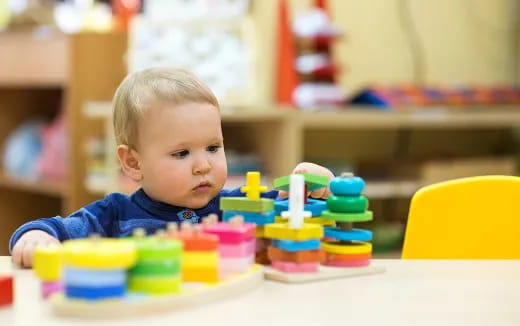 a baby playing with toys