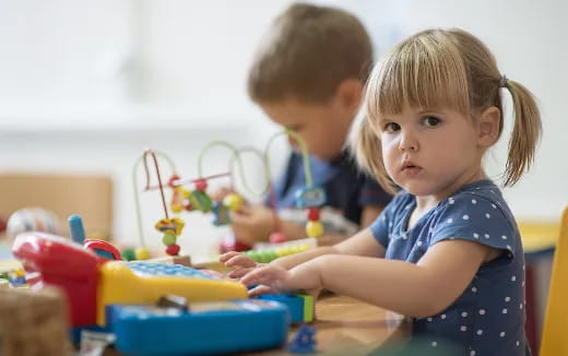 a couple of children playing with toys