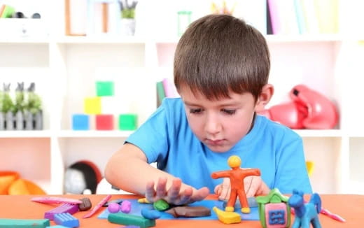a boy playing with toys