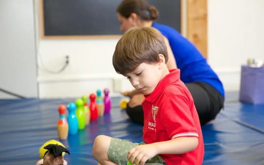 a boy playing with toys