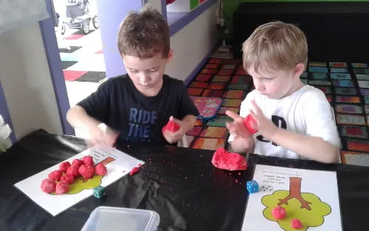 two boys sitting at a table