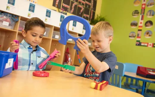 a couple of boys playing with toys