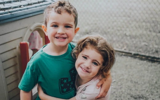 a boy and girl smiling