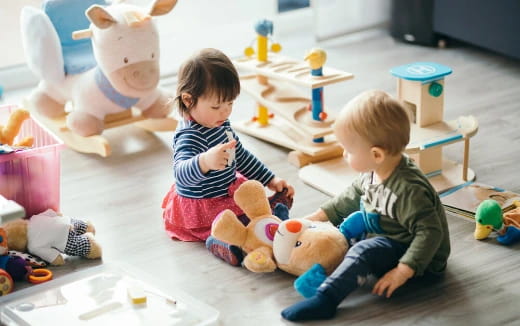 a couple of children playing with toys