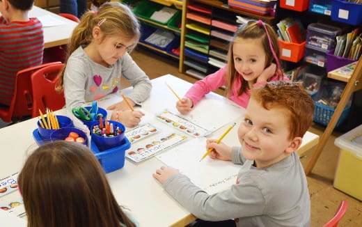 a group of children painting